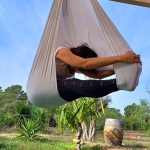 Aerial Yoga in Algarve, forward fold in the yoga hammock